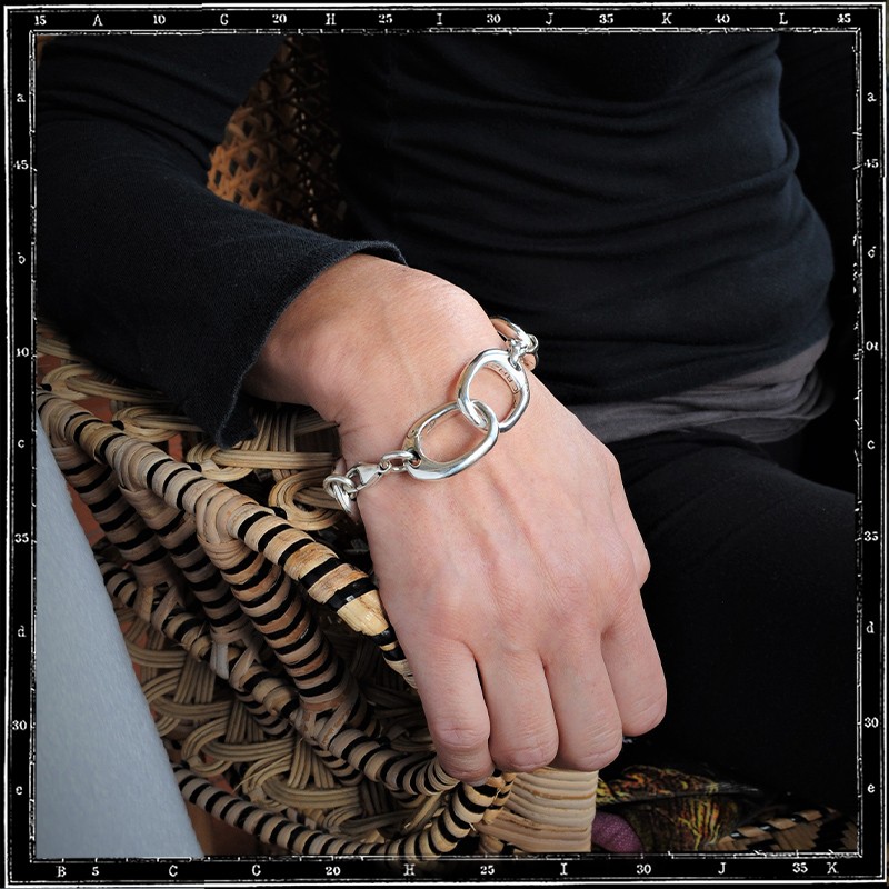 Fine gold steel handcuff bracelet with large rhinestones