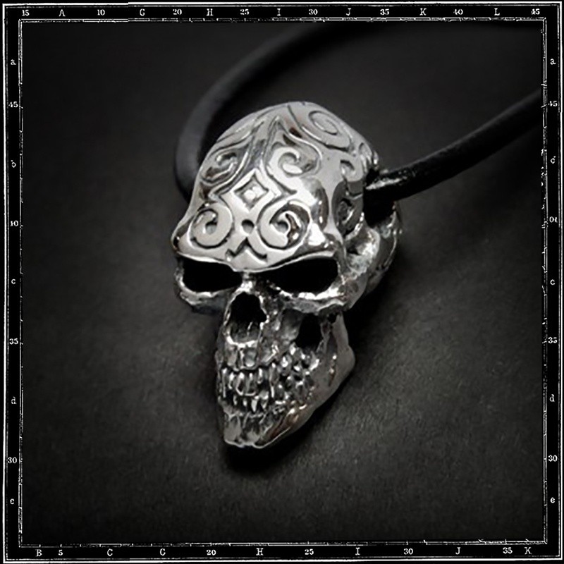 Engraved skull pendant